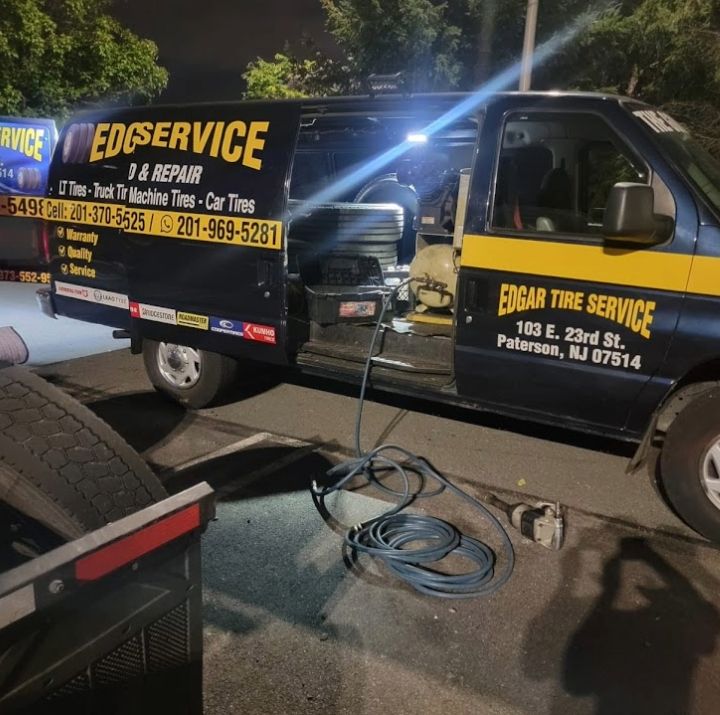 Edgar Tire Service mobile road service van loaded with tire equipment at night