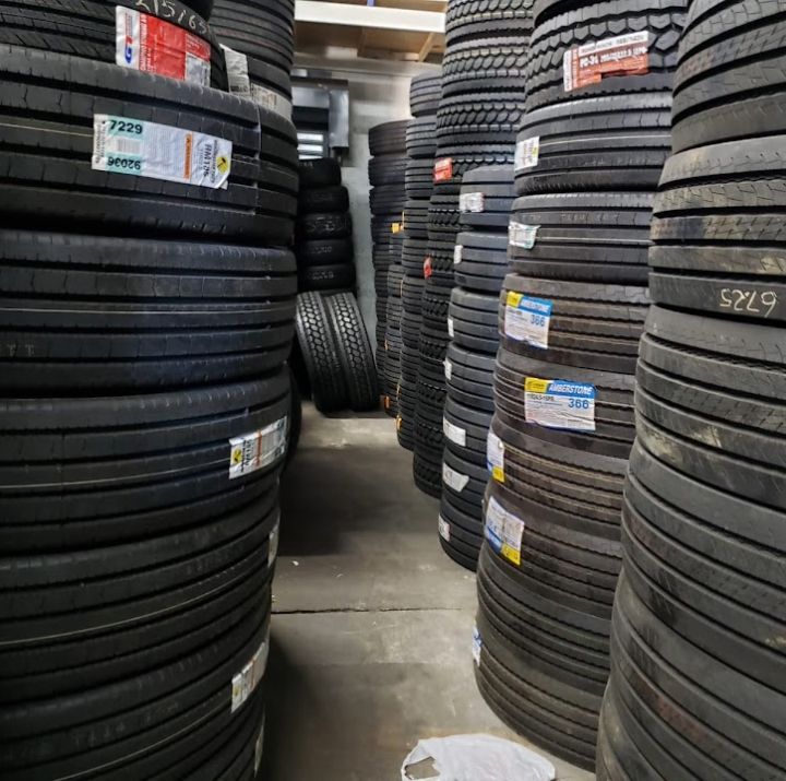 Warehouse stacked with new commercial truck tires at Edgar Tire Service